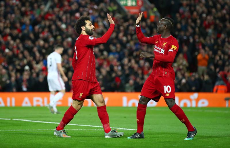 Mohamed Salah of Liverpool celebrates with Sadio Mane