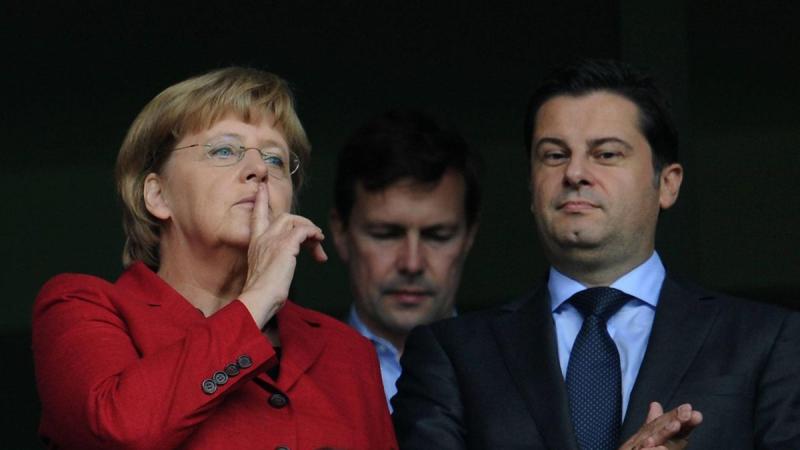 Christian Seifert, président de la DFL avec la chancelière Angela Merkel.